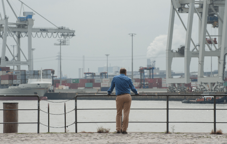 Man looking at a harbor